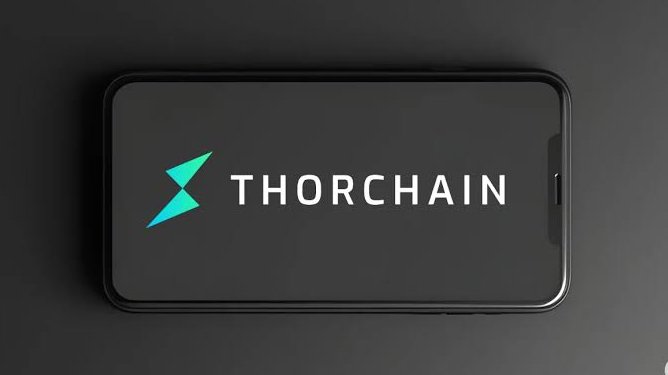 A smartphone mockup displaying the ThorChain logo and name in teal and white on a black screen.
