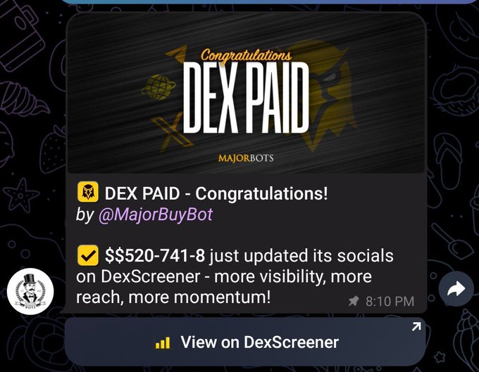 A Telegram bot message from @MajorBuyBot announcing 'DEX PAID' congratulations, stating that $520-741-8 just updated its socials on DexScreener.