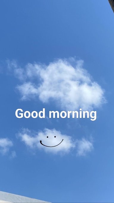 A bright blue sky with fluffy white clouds serves as the backdrop for the text "Good morning," accompanied by a hand-drawn smiley face, perfectly matching the cheerful "Gm frens" greeting and aspirational wish for prosperity.