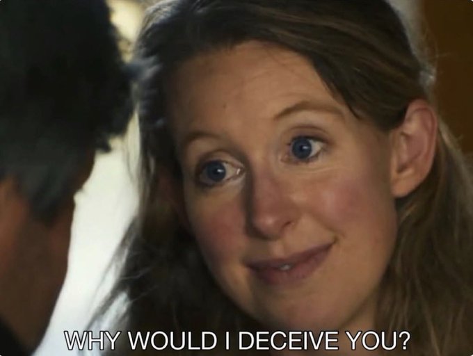 A close-up of a woman with wide blue eyes smiling, looking at a man, with the caption 'WHY WOULD I DECEIVE YOU?'