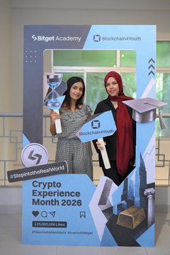 A promotional banner for 'Bitget Academy x Blockchain4Youth' advertising a 'Crypto Experience Month 2026' event with the hashtag '#InspireToReshapeWorld'.