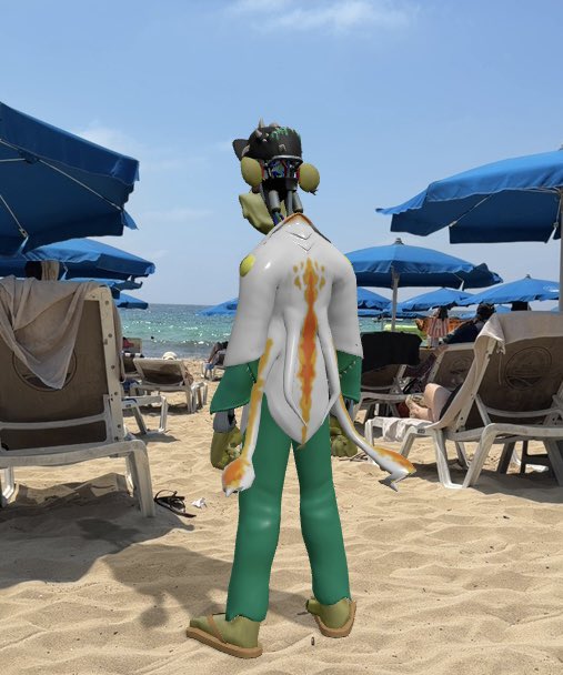 A surreal, computer-generated figure wearing a green and white outfit with flame decals, green pants, and a VR-style headset, standing on a sandy beach with blue umbrellas in the background.