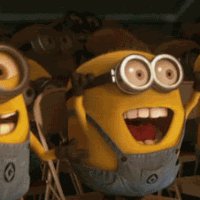 The image features a group of cartoon characters wearing matching yellow outfits with big smiles on their faces. The main character has his mouth open wide, seemingly shouting or laughing, while the others around him are also smiling and looking at the camera. The scene appears to be set in an indoor space, possibly a room filled with chairs where they are gathered together.