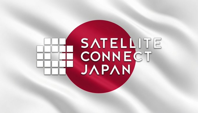 The image displays a flag-like banner featuring the "Satellite Connect Japan" logo—a white pixelated satellite design overlaid on a red circle, resembling Japan's flag motif—set against a waving white background. This relates to the post "$ASTS" (AST SpaceMobile), highlighting a Japan-based satellite connectivity partnership or presence for the company.