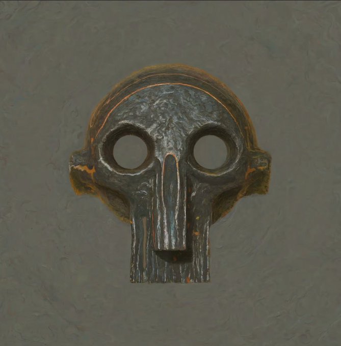 A weathered skull mask with hollow, glowing eye sockets hangs against a dim gray wall, its dark, cracked surface suggesting age and foreboding—evoking the eerie stillness of something safely locked away in a vault, waiting in darkness for whatever lies ahead.