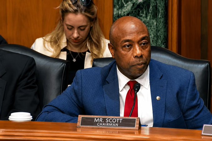 Senator Tim Scott, identified by a nameplate reading "MR. SCOTT, CHAIRMAN," presides over a hearing as Senate Banking Committee Chairman, pictured here ahead of his announcement that the CLARITY Act crypto regulation bill could be voted on before August recess.
