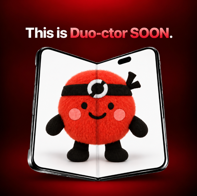 A promotional graphic with a red background featuring a foldable smartphone displaying a cute red mascot character, with text reading "This is Duo-ctor SOON."