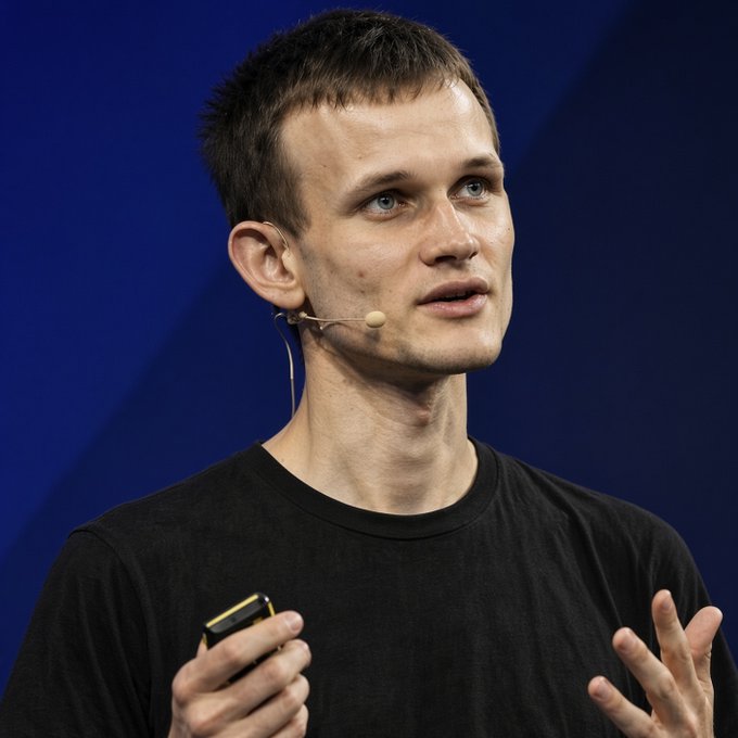 Vitalik Buterin, co-founder of Ethereum, speaks while holding a presentation clicker and wearing a headset microphone, as he advocates for EIP-8288—a proposal introducing recursive STARK mempools to enable lower-cost quantum-safe transactions in a future Ethereum fork.