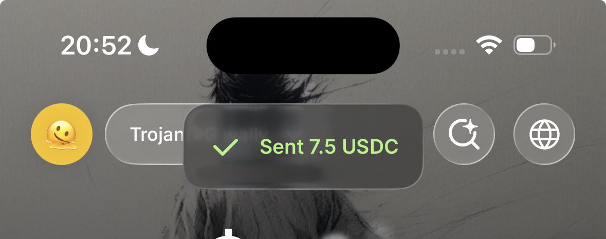 A smartphone lock screen at 20:52 displays a confirmation notification reading "Sent 7.5 USDC" alongside a "Trojan" tab, corroborating the post about splitting $15 USDC between the two tagged users.
