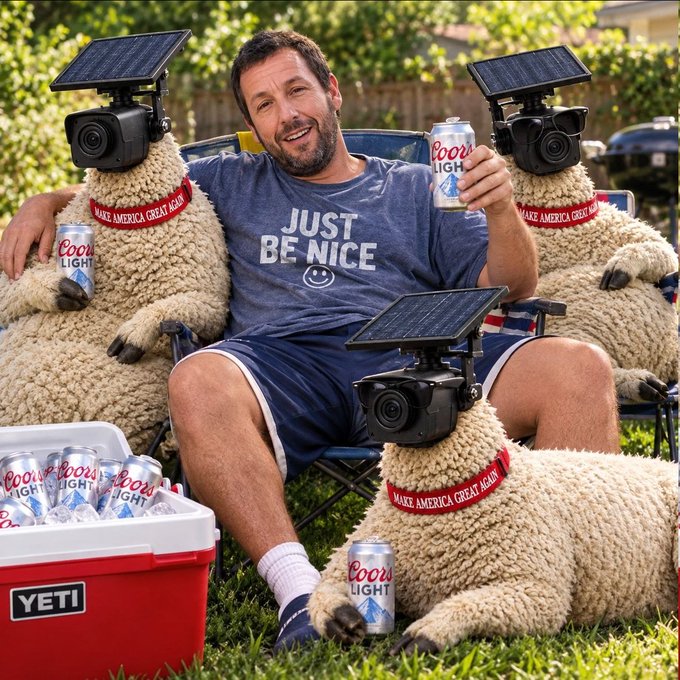 Adam Sandler sits in a camping chair holding a Coors Light, wearing a 'JUST BE NICE' t-shirt, surrounded by sheep wearing cameras and 'MAKE AMERICA GREAT AGAIN' hats, with a YETI cooler full of beer.