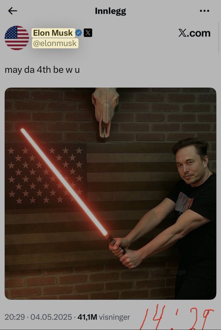 A post by Elon Musk (@elonmusk) on X.com reads 'may da 4th be w u' and shows a photo of him wielding a red lightsaber in front of an American flag and a skull mounted on a brick wall.