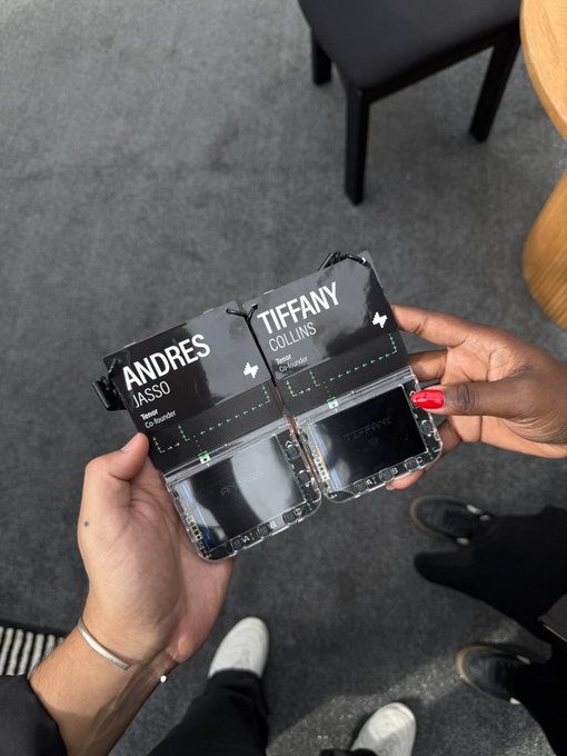 Two people holding up their ID badges with the names 'ANDRES JASSO' and 'TIFFANY COLLINS' clearly visible.