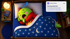 A mobile app notification from 'Snoring detected' shown over a 3D illustration of a sleeping green character under a starry blanket.