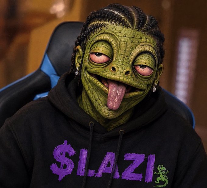 A stylized portrait of a person wearing a green reptilian/alien mask with their tongue sticking out, dressed in a black '$LAZI' hoodie featuring a gecko logo, sitting in a gaming chair.