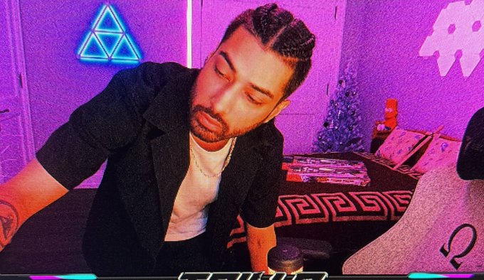 A bearded man in a black shirt looks down intently, possibly at a screen or gambling interface, in a neon-lit room with purple and blue lighting and decorative elements like a small Christmas tree. The image appears to be a still from a livestream on Kick.com by Trilla, who is promoting a gambling session on Gamdom with $2500 balance, sponsored by SteveWillDoIt, as indicated by the on-screen text overlays.