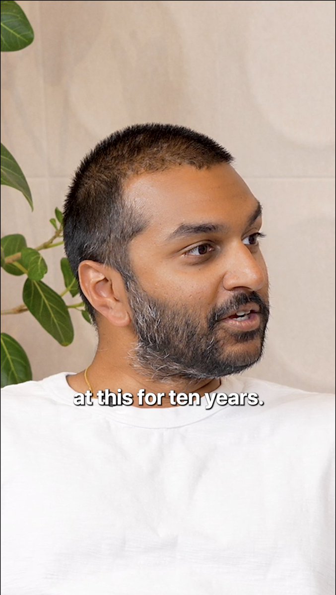 A man with a beard and white shirt speaks while looking off-camera, with the subtitle "at this for ten years." visible at the bottom of the frame. The image complements a post about Aptos Foundation's founders discussing long-term conviction in building a lasting venture, as conveyed through the highlighted text about enduring a decade of dedication.