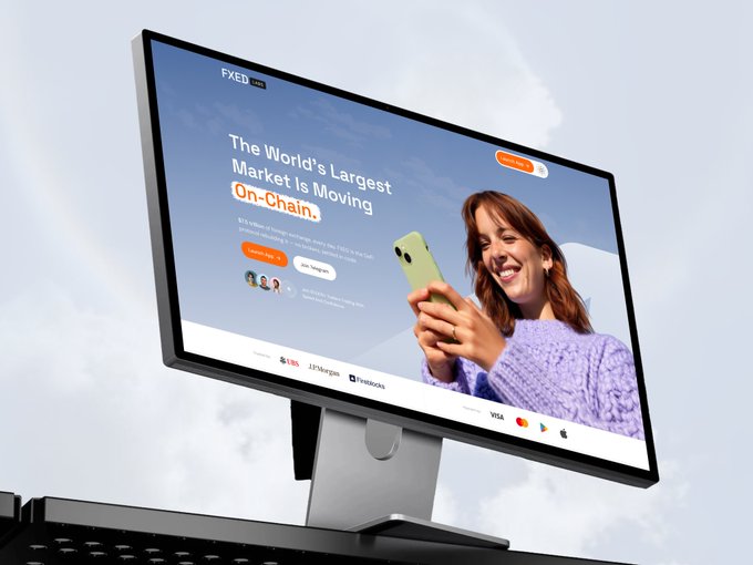 A computer monitor displays a webpage for FXED, with the headline "The World's Largest Market Is Moving On-Chain" and a tagline about US$11.4 trillion in FX volume, featuring an image of a smiling woman holding a green phone, along with logos for UBS, JPMorgan, and Mastercard.