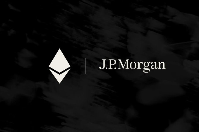 Minimalist dark promotional image showing a stylized diamond/octahedron logo alongside the 'J.P.Morgan' wordmark against a shadowy abstract background.