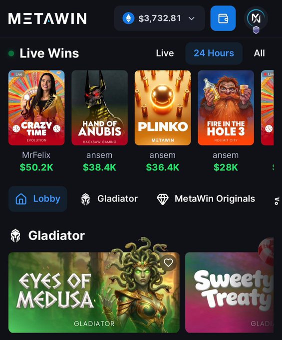 A screenshot of the MetaWin online casino platform displays a "Live Wins" section showing recent payouts including $50.2K from MrFelix on Crazy Time and multiple wins by user "ansem" ranging from $28K to $38.4K across games like Hand of Anubis, Plinko, and Fire in the Hole 3. The image showcases high-profile gambling wins on the platform being promoted in a deposit bonus advertisement offering $1k free on top of $1k deposits at metawin.com.