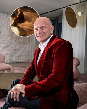 Billionaire investor Mike Novogratz sits smiling in a red blazer at a stylish interior, with an inset showing him in a separate setting. The image accompanies his bullish prediction that the crypto-focused CLARITY Act will pass before the August congressional recess.