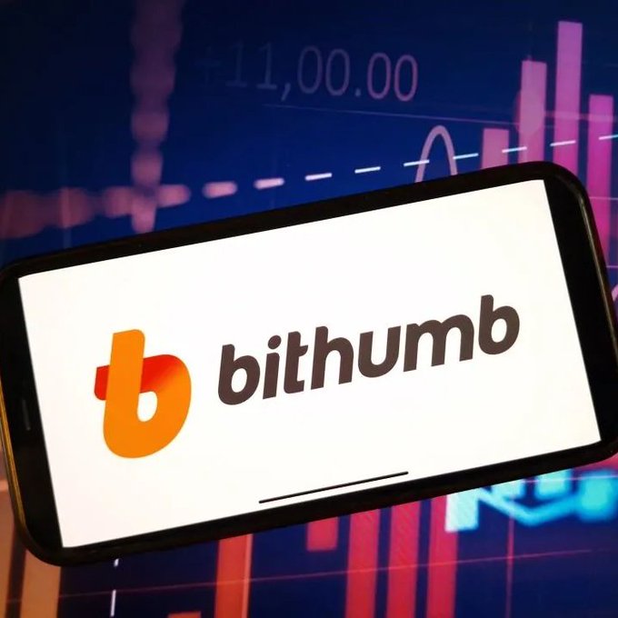 A smartphone displaying the Bithumb logo is shown in front of a background featuring a stock or cryptocurrency chart with pink and red bars and the number "11,000.00".