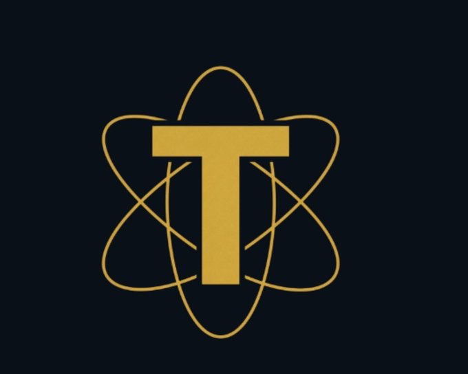 A gold "T" letter encircled by atom-like orbital rings is displayed on a dark background, representing the Torium ($TOR) project logo. The image visually anchors the Torium side of a comparison highlighting Torium's 2 billion $TOR total supply and testnet mining versus InterLink's larger token structure.