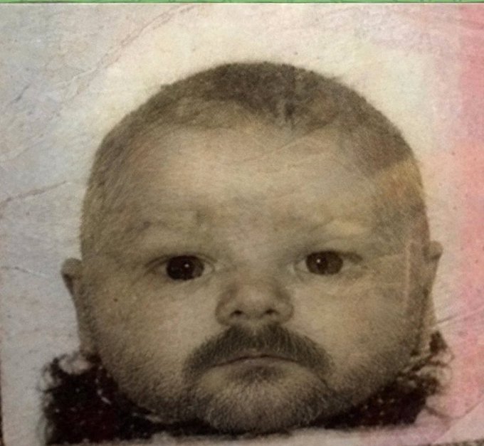 A sepia-toned vintage photograph of a baby with an artificial beard photoshopped onto its face, humorously questioning whether facial hair could fool Bybit's KYC (Know Your Customer) identity verification process.