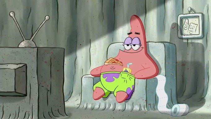 Patrick Star lounges contentedly in his armchair, eating a slice of pizza and sipping a drink, with a framed photo of SpongeBob and himself hanging on the wall behind him.