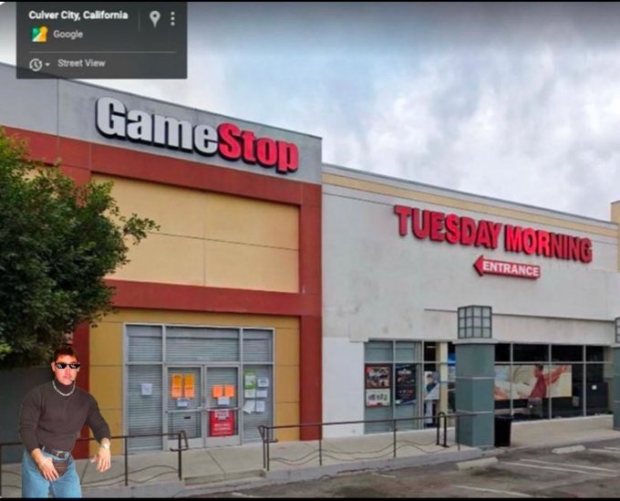 A Google Street View screenshot from Culver City, California showing a GameStop storefront next to a 'TUESDAY MORNING' entrance, with a person in sunglasses and a black shirt edited into the foreground.