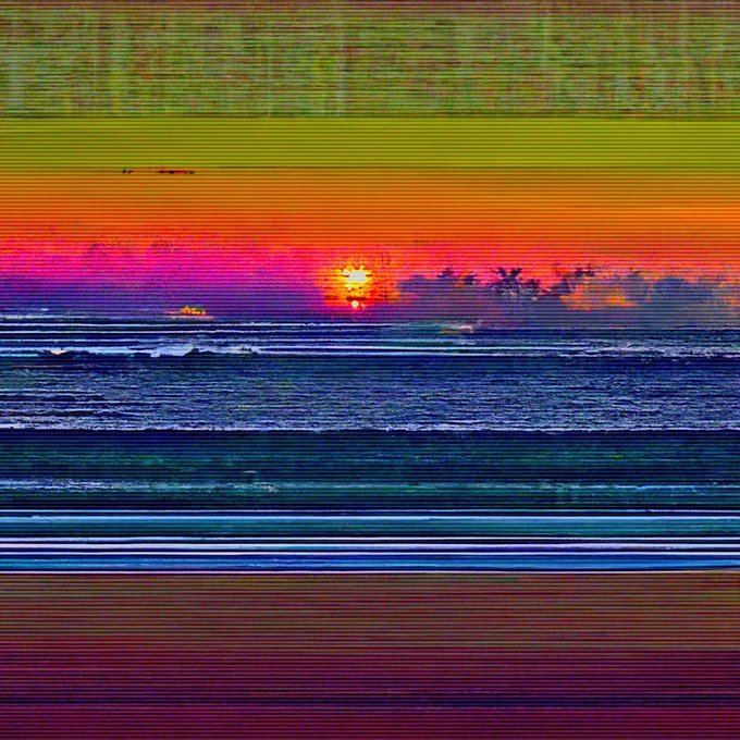 The image features a vibrant sunset over the ocean, with the sun setting behind the water. The sky is painted in shades of orange and yellow, creating a stunning backdrop for the scene. The photo has been edited using a filter that gives it a striped appearance, adding an artistic touch to the overall look. The caption below the image reads "FALSE_VISTA 008 [2022] Huge congrats @absurdeity for finally scoring one of these after months of full collection offers (and a dope one at that)!! #lovetoseeitinyourcollection".