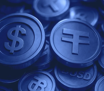 The image features a close-up view of various blue coins, including some with the letters "BS" and "USDT" written on them. These coins are scattered across the frame, creating an interesting visual effect. The text accompanying the image reads: "Look at this BS. That'S why we need Monero." This statement suggests that the coins in the image might be related to Bitcoin or another cryptocurrency, and it emphasizes the importance of Monero as a cryptocurrency for the future.