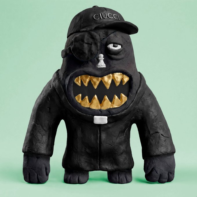 A black sculptural figurine by CIUCCI featuring a cap with the brand name, a silver nose ring, and a large mouth with prominent gold teeth, set against a mint green background.
