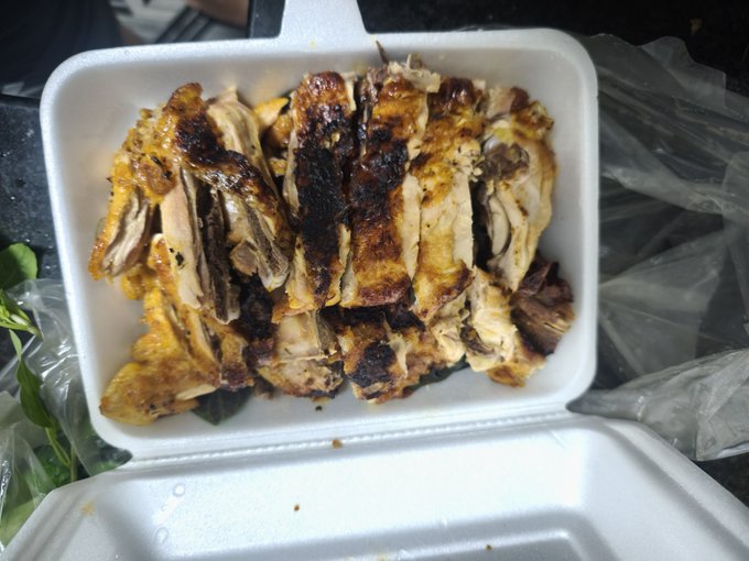 Roasted chicken pieces are packed in a white styrofoam container, visually representing the 'energy' mentioned in the text about trading memes.