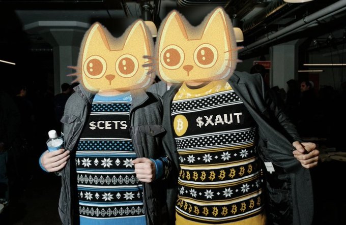 Two people wear sweaters with crypto tickers, one reads "$CETS" and displays Ethereum logos, while the other reads "$XAUT" and features Bitcoin logos, suggesting they're participating in the onchain wealth mentioned in the post.