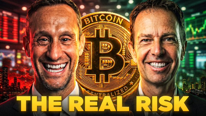 The image features two smiling men in suits positioned on either side of a large golden Bitcoin coin, with "BITCOIN CENTRALIZED" inscribed on it, and bold yellow text reading "THE REAL RISK" across the bottom. The promotional thumbnail relates to the post by highlighting Jeff Booth's extensive research into Bitcoin's flaws, suggesting the "real risk" discussed is Bitcoin's centralization—the core finding from his years of trying to "kill" the cryptocurrency.