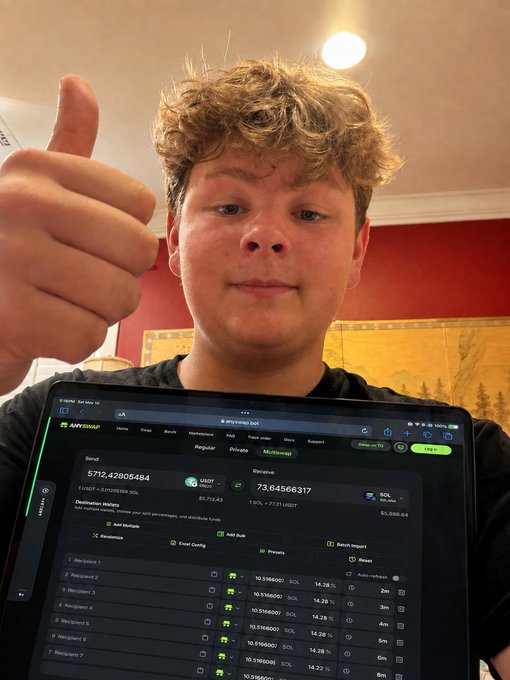 A young person giving a thumbs-up while displaying a tablet screen showing the anYswap interface with cryptocurrency swap details including USDT and SOL balances.