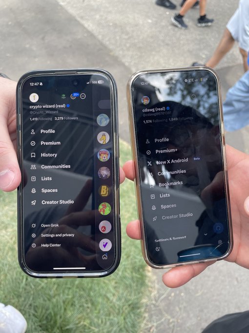 Two people hold iPhones displaying the X (formerly Twitter) app side menu, with profiles visible including "crypto wizard (real)" (@Crypto_Wizard) showing 1,419 Following, 3,279 Followers, and "cdawg (real)" (@cdawg) showing 1,574 Following, 1,843 Followers, humorously framing a casual outdoor encounter as a "business meeting."