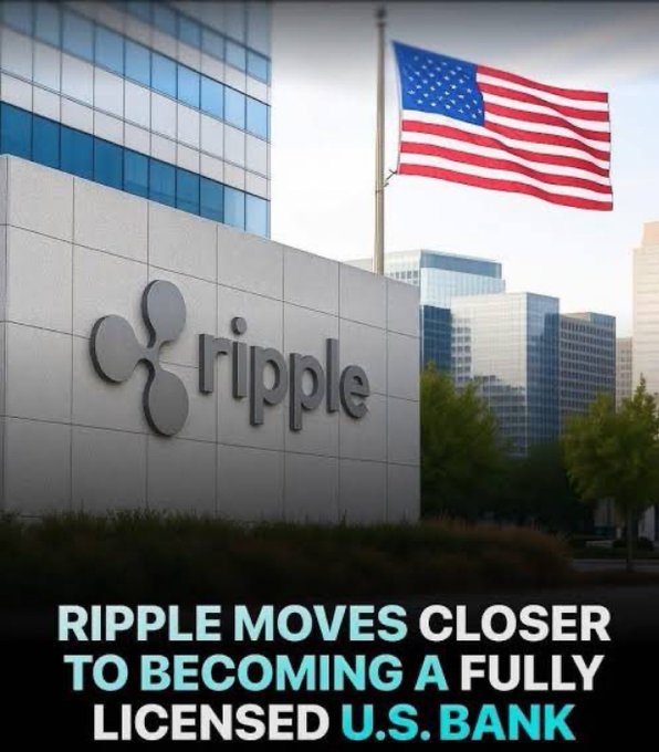 Ripple company logo on a building facade with an American flag flying above, captioned 'RIPPLE MOVES CLOSER TO BECOMING A FULLY LICENSED U.S. BANK'.