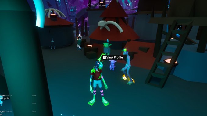 A screenshot from a 3D video game showing several cartoonish avatars in a dark village setting with red-roofed huts and a wooden ladder, with a 'View Profile' tooltip visible.