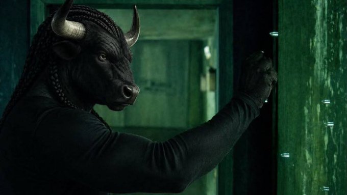 A person in a black bull mask leans against a green-lit door, evoking a stealthy, bullish vibe that complements the poster's promotion of a $NIGGABULL meme coin pump.