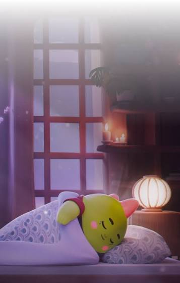 A green Kirby-themed Sleepagotchi plush rests on a pillow in a dimly lit, cozy bedroom with glowing candles and a paper lantern, perfectly capturing the user's return to their nighttime routine and the comforting, sleepy atmosphere of the Sleepagotchi app.
