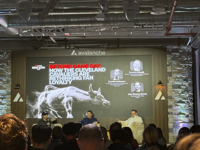 A panel discussion at an Avalanche-sponsored event titled 'Beyond Game Day: How the Cleveland Cavaliers Are Rethinking Fan Loyalty,' featuring panelists Brandon Brosek, Dominic Carberano, and John Tiemeyer-Gomez seated on stage before an audience.