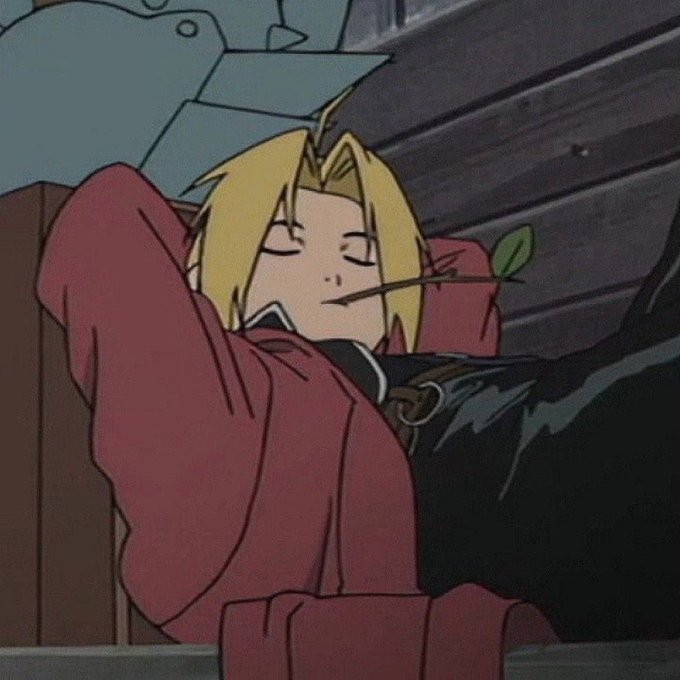 An animated scene of the character Edward Elric from Fullmetal Alchemist, a blonde boy in a red coat, lying back with his eyes closed and a small leaf held in his mouth.