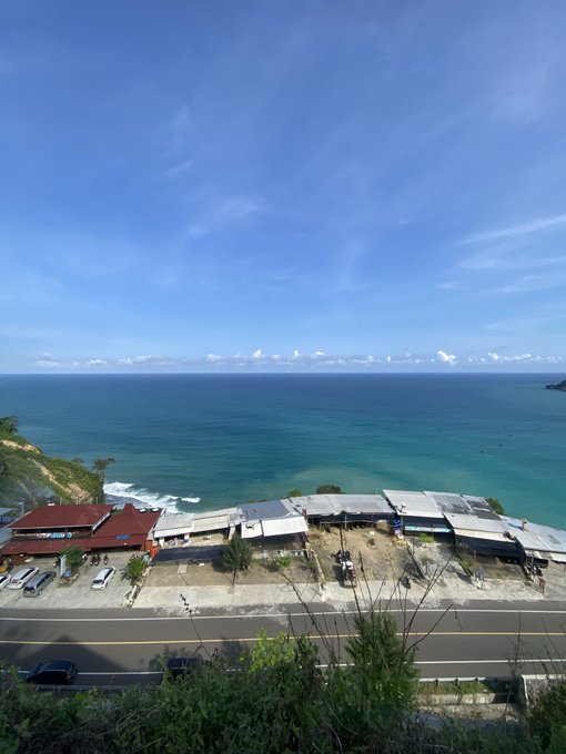 The image shows a view of a beach town with several buildings, including a restaurant or bar, situated near the ocean. The sky above appears blue with some clouds scattered throughout. The focus of the image seems to be on the relationship between Web3 and its users, as it is described as "Web3 won't be defined by who attracts the most attention." This implies that the future of Web3 lies in how well-built and reliable the systems are, rather than being determined by the number of people talking about them or their popularity. The image also includes a car parked near one of the buildings, suggesting that it could be a popular spot for visitors to enjoy the beach town atmosphere while contemplating the future of Web3.