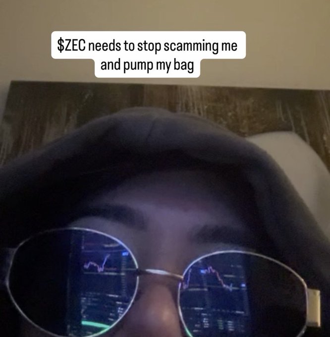 A meme image of a person in a hoodie and sunglasses with chart reflections in the lenses, captioned '$ZEC needs to stop scamming me and pump my bag'.