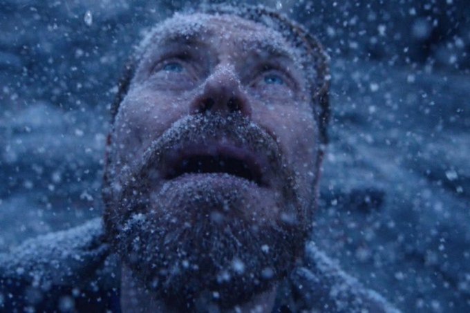 A bearded man with a snow-covered face gazes upward in a snowy setting, his frostbitten expression conveying awe. The image humorously illustrates the post's message about Mr. Pool watching his viewership skyrocket, as he stares in amazement at the soaring numbers.