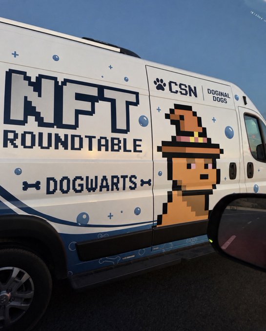 A white van wrapped with pixel-art graphics reading 'NFT ROUNDTABLE' and 'DOGWARTS' alongside a wizard-hat-wearing Doginal Dogs character, branded with 'CSN'.