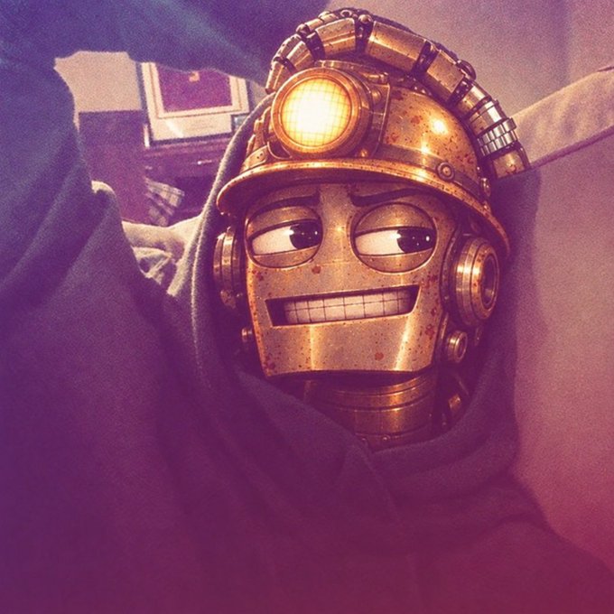 A 3D-rendered golden robot with a glowing headlamp and exposed teeth peeks out from under a blanket with a tired, half-lidded expression.