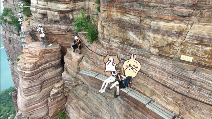 Hikers traverse a narrow wooden plank walkway bolted to a sheer cliffside, with two figures' faces obscured by Pokémon stickers (Pokabu and Minun) for privacy. The caption humorously frames the precarious path as a desperate rush to catch a rare Pokémon amid financial ruin, joking that the cliff offers a convenient escape if the investment fails.