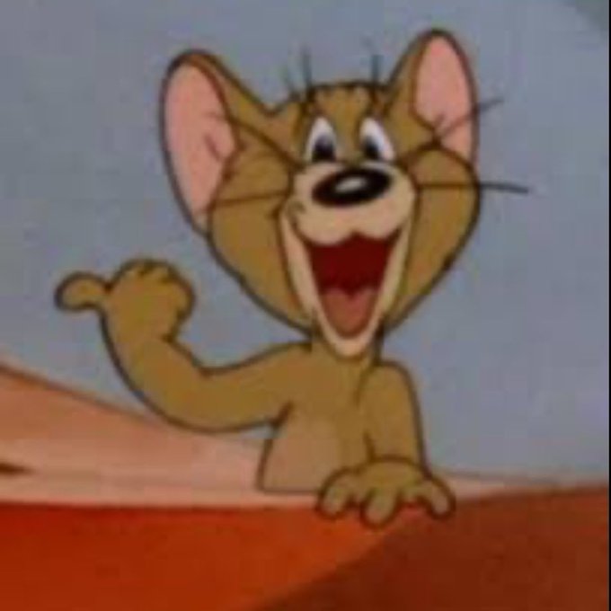 A classic cartoon frame of Jerry the mouse from Tom and Jerry laughing and pointing cheerfully.
